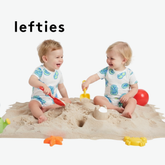 LEFTIES WHITE ROMPER WITH BEACH ELEMENT DOODLES