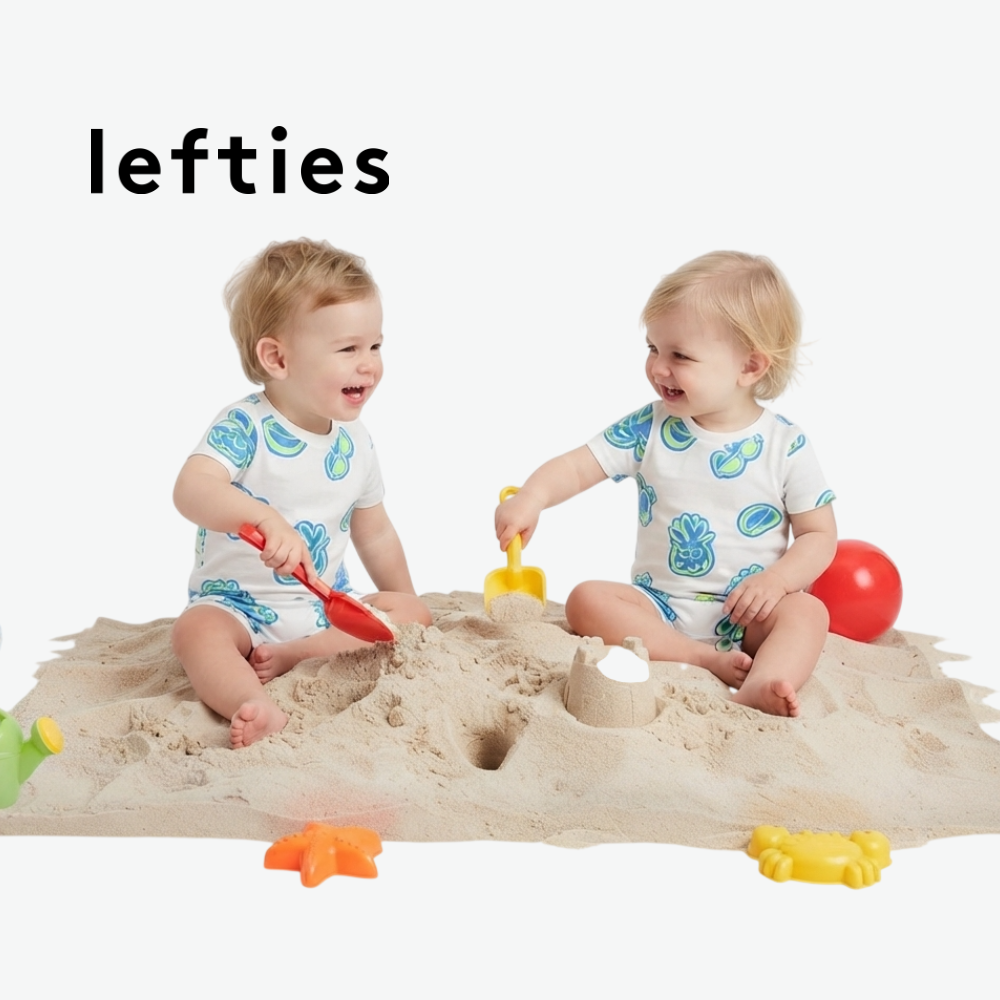 LEFTIES WHITE ROMPER WITH BEACH ELEMENT DOODLES