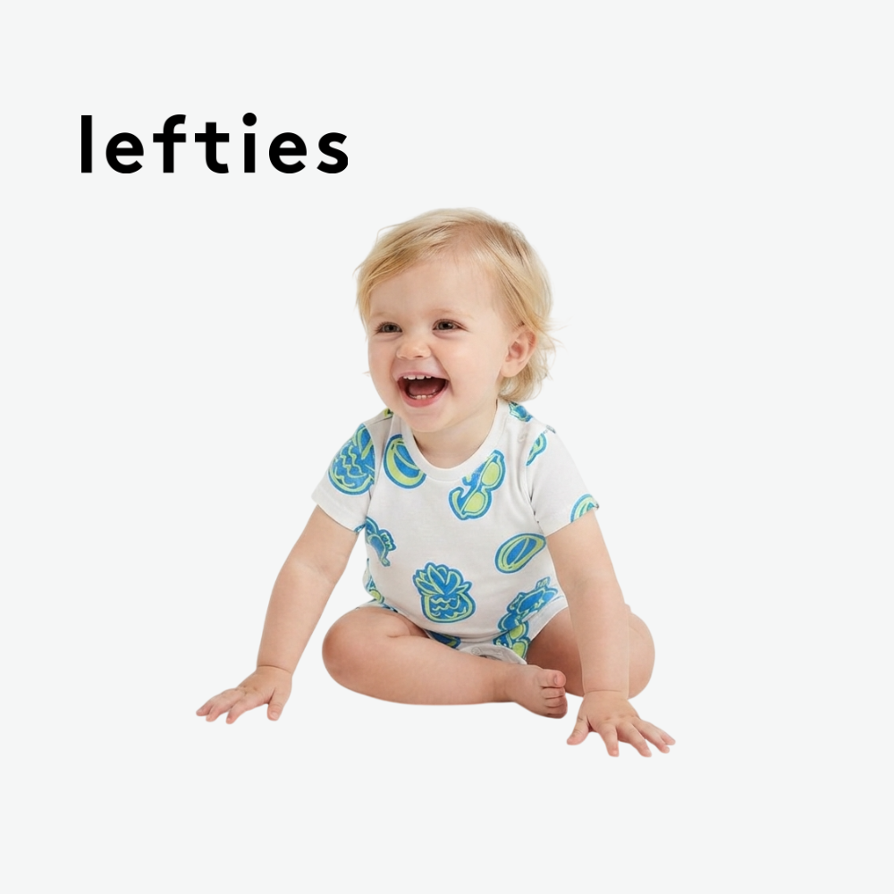 LEFTIES WHITE ROMPER WITH BEACH ELEMENT DOODLES