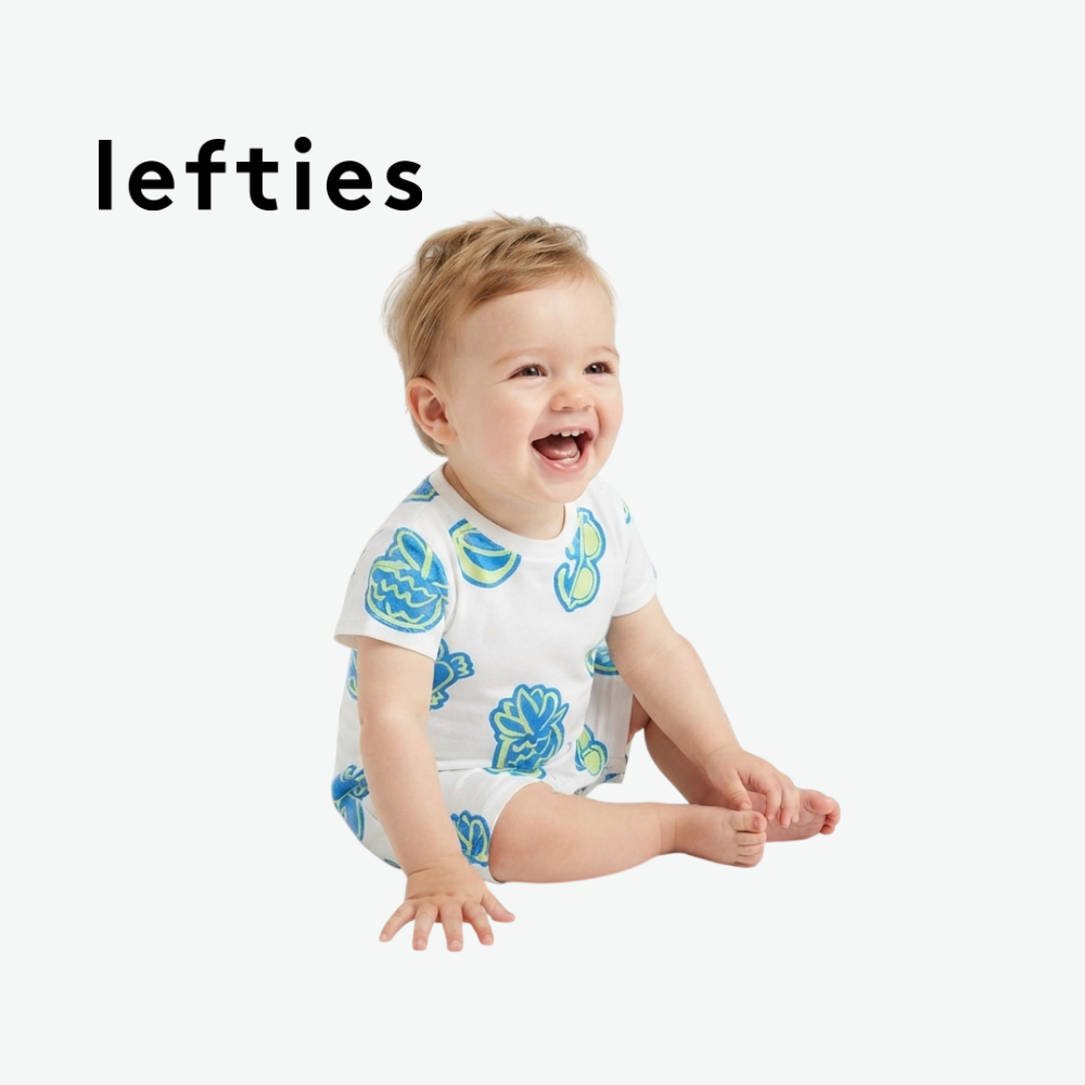 LEFTIES WHITE ROMPER WITH BEACH ELEMENT DOODLES
