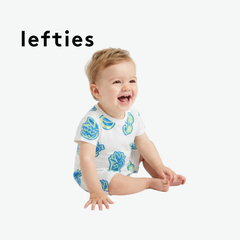 LEFTIES WHITE ROMPER WITH BEACH ELEMENT DOODLES
